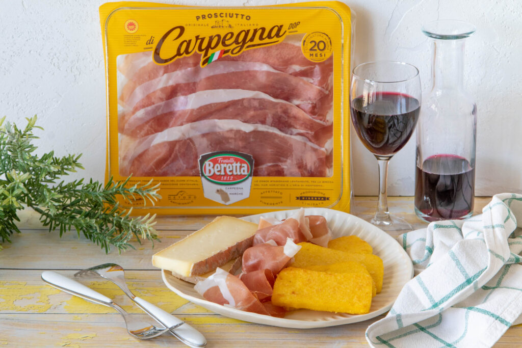 Polenta bruscata con taleggio e Prosciutto di Carpegna DOP