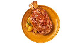 Stinco di maiale con patate sabbiose